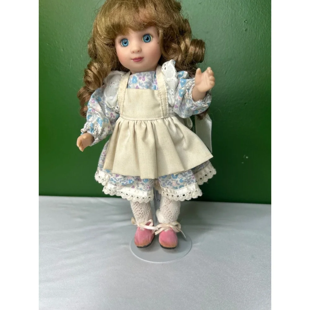 Vintage Porcelain Collector Doll Blue Eyes Floral Dress Cream Apron with Stand